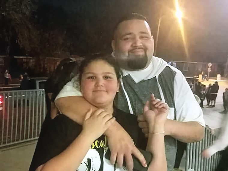 Arturo Valles poses with his 13-year-old daughter.