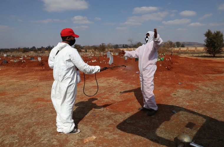 Image: Funeral workers in South Africa