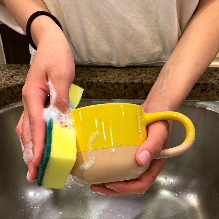 This soap dispenser with a sponge holder is a game changer