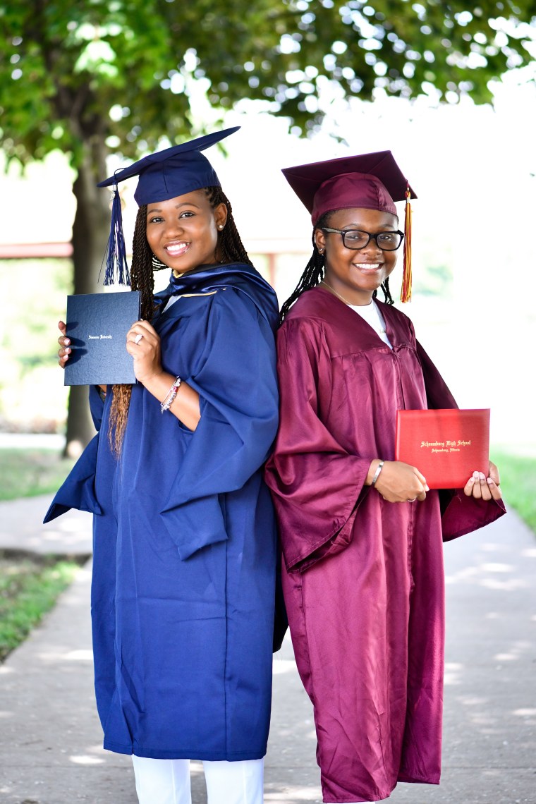 Mom Quiana Cohn and daughter India Cohn show off their diplomas while wearing their graduation caps and gowns.