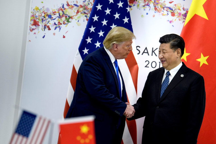 Image: President Donald Trump greets China's President Xi Jinping during the G20 Summit in Osaka on June 29, 2019.