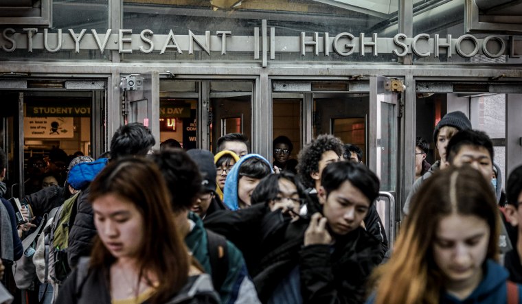 Image: Students leave Stuyvesant High School in New York on March 13, 2020.