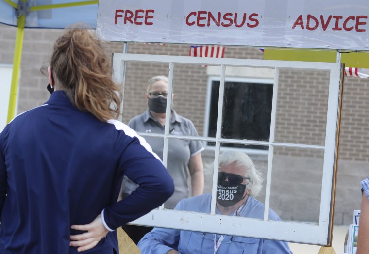 Census worker Ken Leonard wears a mask as he mans a U.S. Census walk-up counting site set up for Hunt County in Greenville, Texas, on July 31, 2020.