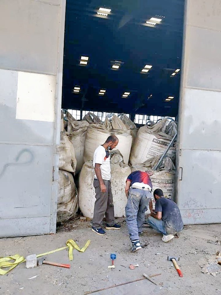 An undated photo appears to show bags of ammonium nitrate stored inside a warehouse reportedly at the Port of Beirut.