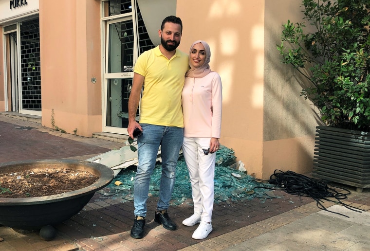 Image: Bride Israa Seblani poses for a picture with her husband Ahmad Subeih in Beirut