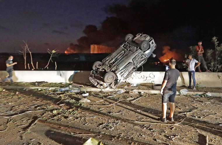 Cars overturned by the chemical explosion at Beirut's port on Tuesday. 