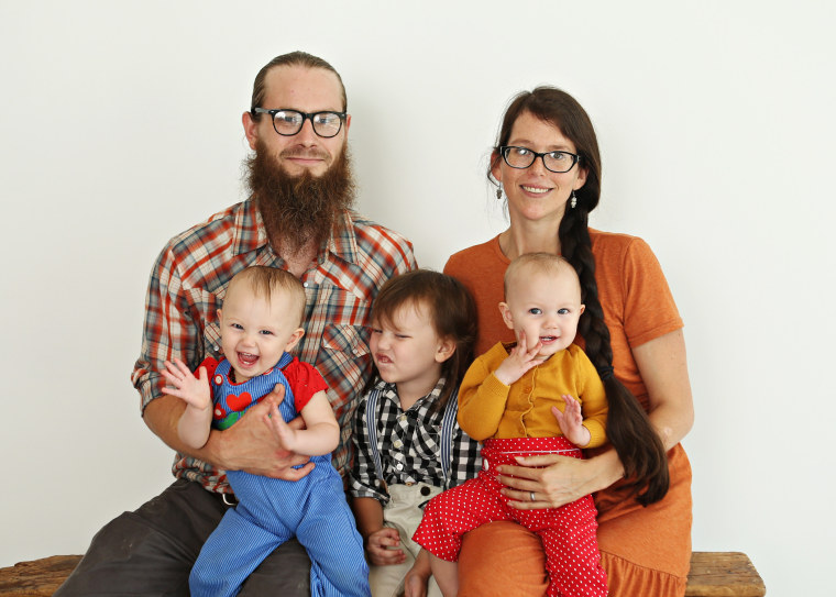 Lyndsey and Wesley Altice with their children, Django, 3, and Ada and Billie, 1.