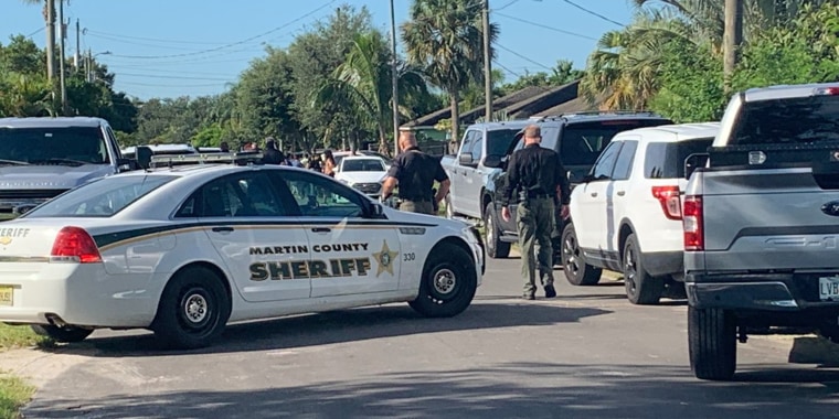 Police with the Martin County Sheriff's Office investigate a shooting in Indiantown, Fla., on Aug. 11, 2020.
