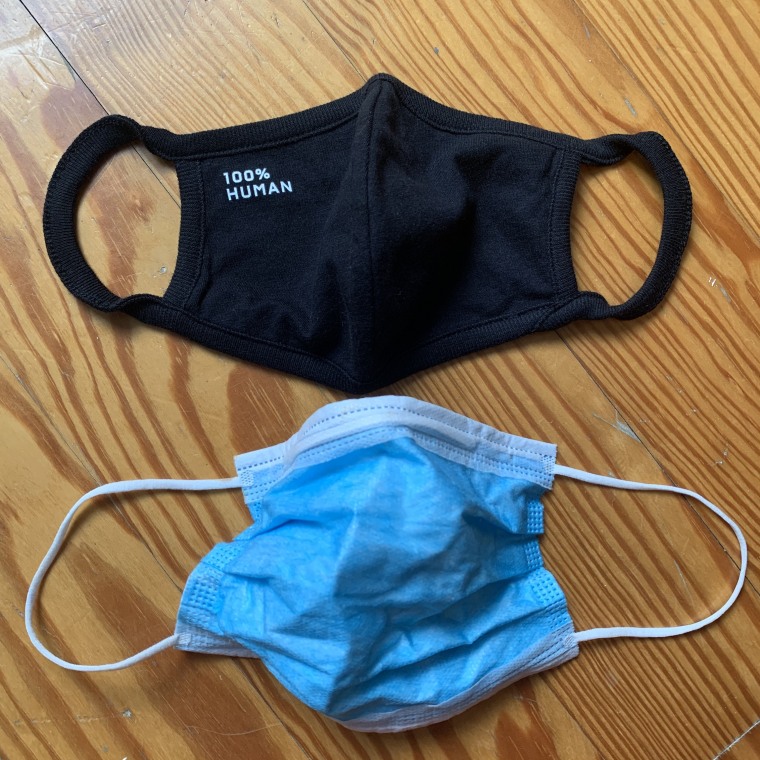 Everlane 100% Human Face Mask and a disposable face mask