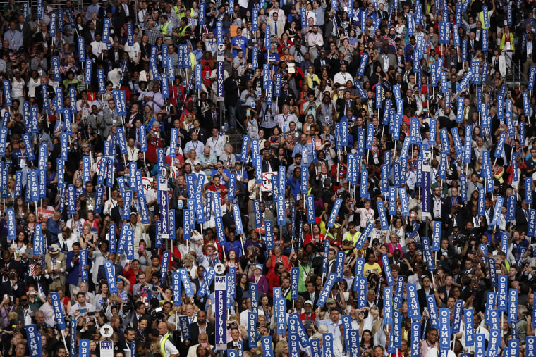 Delegates hold signs for President Barack Obama at the Democratic National Convention in Philadelphia