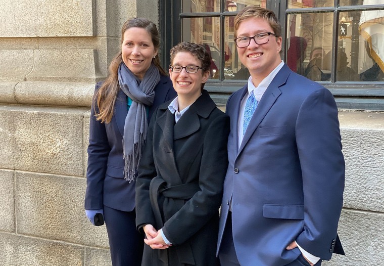 Plaintiff Drew Adams, right, with his mother, Erica Kasper, and a Lambda Legal lawyer outside the 11th U.S. Circuit Court of Appeals after oral arguments.