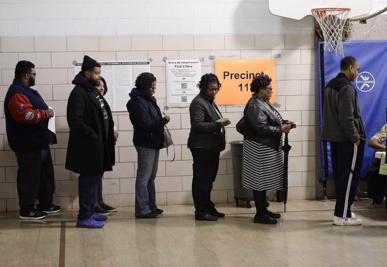 Voters wait in line on Election Day in Southfield, Mich., on Nov. 6, 2018.
