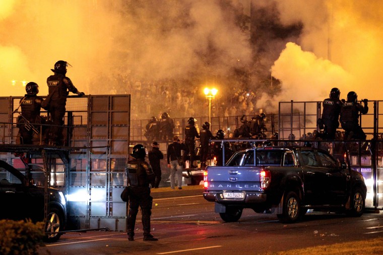 Image: Riot police disperse protesters after polls closed in the presidential election, in Minsk, Belarus