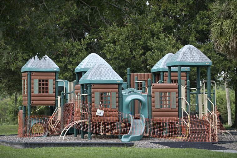 A playground is cordoned off to prevent use at a public park on Aug. 6, 2020, in Orlando, Fla.