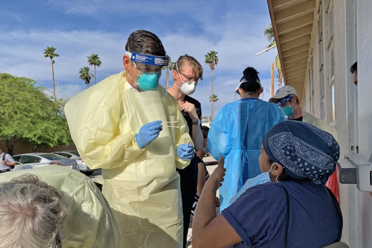Rep. Raul Ruiz, D-Calif., administers tests to farmworkers and their families at Centro Familiar Guadalupano in Mecca in California's Coachella Valley and helps provide information on preventing the spread of the coronavirus in conjunction with Volunteers in Medicine.
