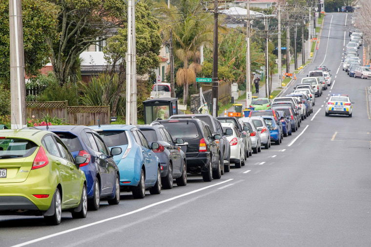 Image: Motorists queue at a COVID-19 coronavirus testing centre in the suburb of Northcote in Auckland, New Zealand