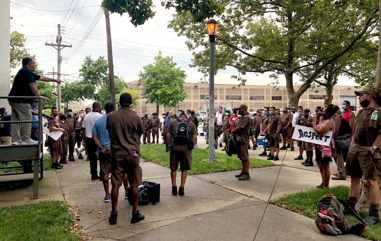 Local union president Vinnie Perrone, left, speaks to UPS workers at a protest of working conditions at their Brooklyn facility on July 24, 2020.