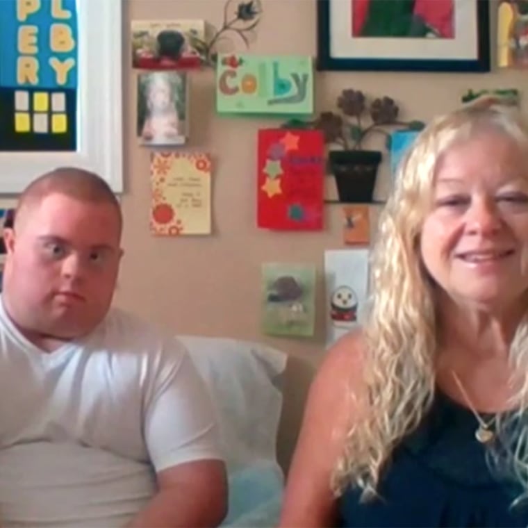 Colby Douglas with his parents at home in New Jersey