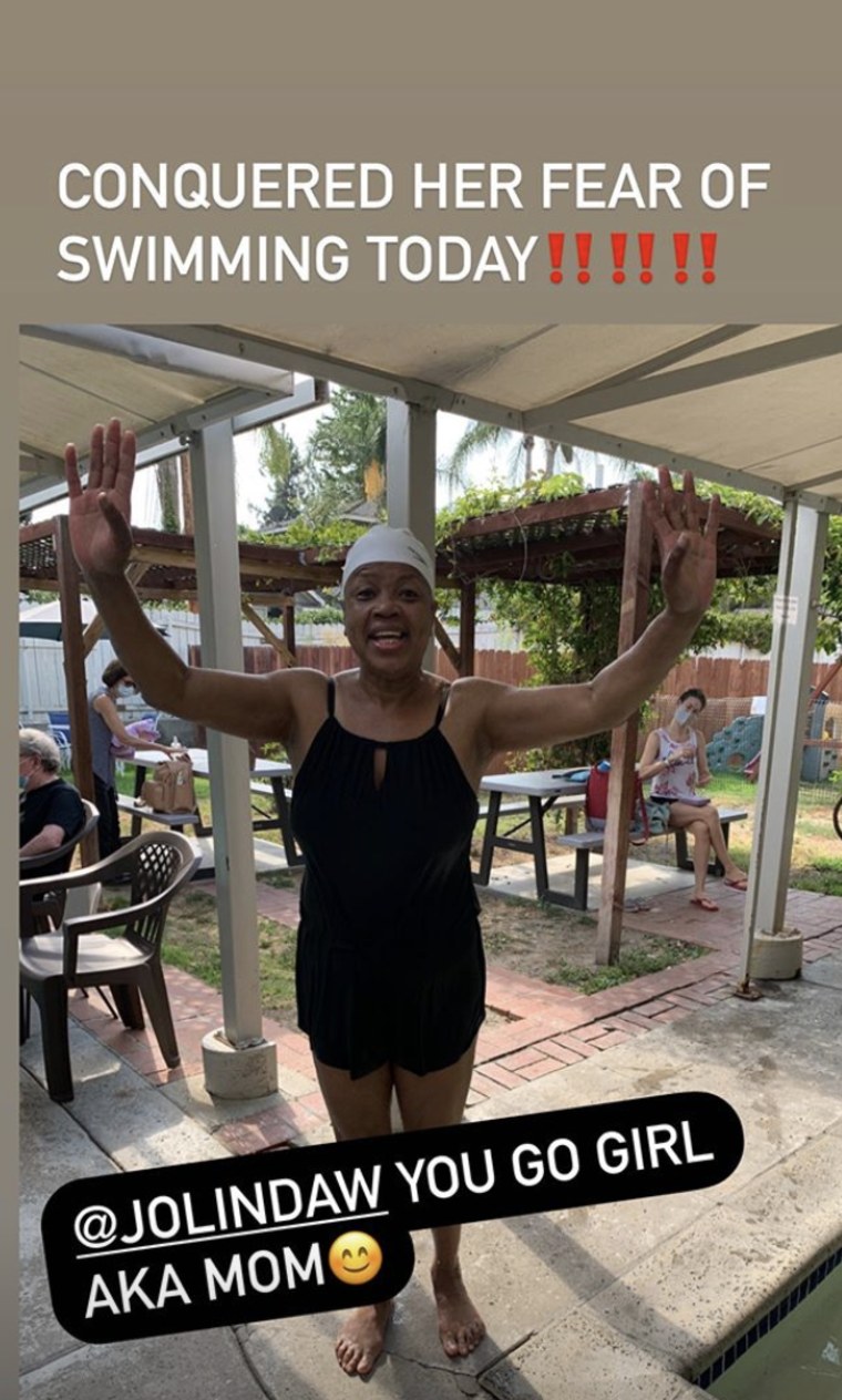 Jolinda Wade cheers after going for a swim and conquering her fear.