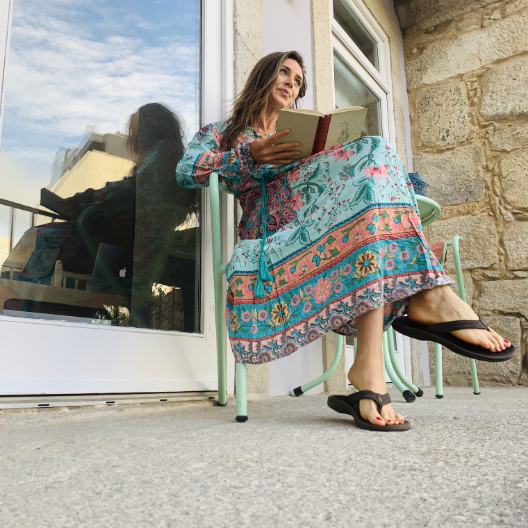 wearing the R. Vivimos dress while reading on my balcony