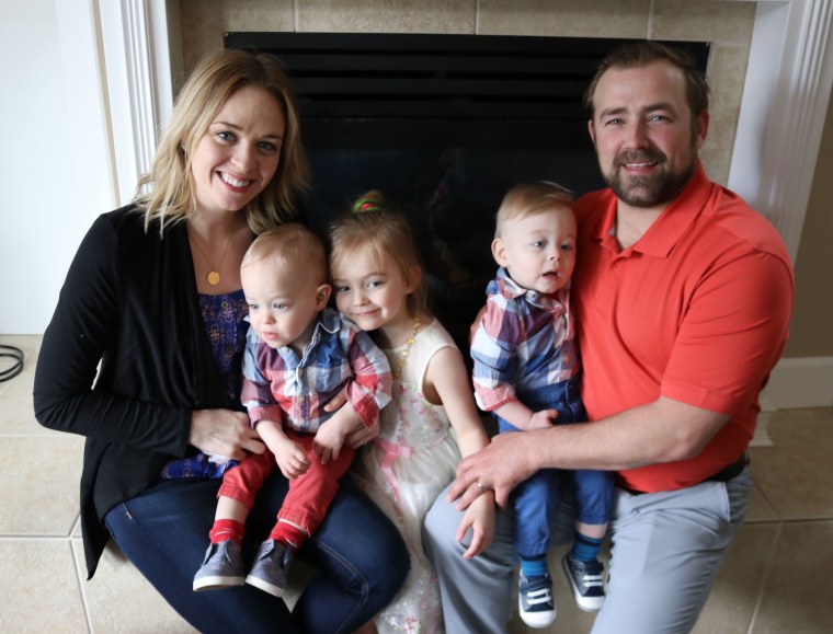 Savannah and Kyle O'Malley with their children, Poppy, 5, and Lex and Lochlan, 3.