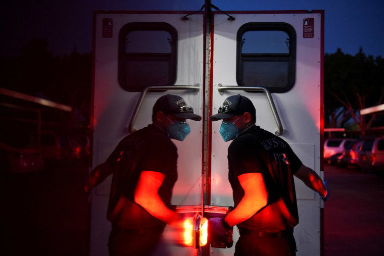 Firefighters wear protective equipment to prevent the spread of COVID-19 in Texas