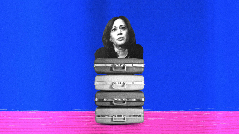 Image: Kamala Harris sits on top of a stack of suitcase baggage.