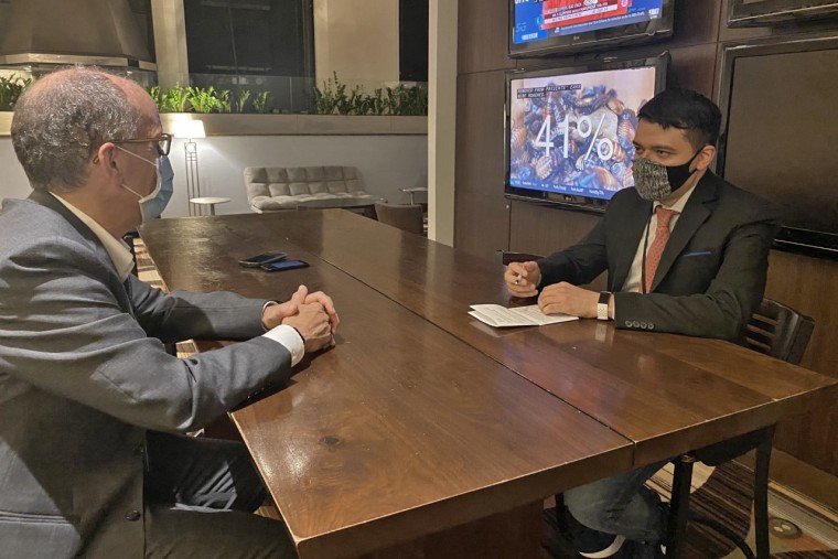 NBC News national political reporter Sahil Kapur, right, interviews Democratic National Committee chair Tom Perez in Milwaukee on Aug. 17, 2020.