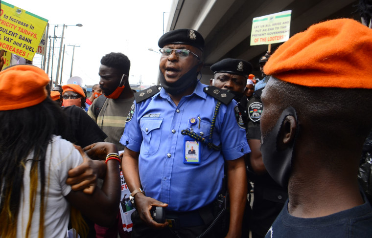 Image: A police man reacts to demonstrators and supporters during "#Revolution Now" protests in Lagos, Nigeria on August 5, 2020.