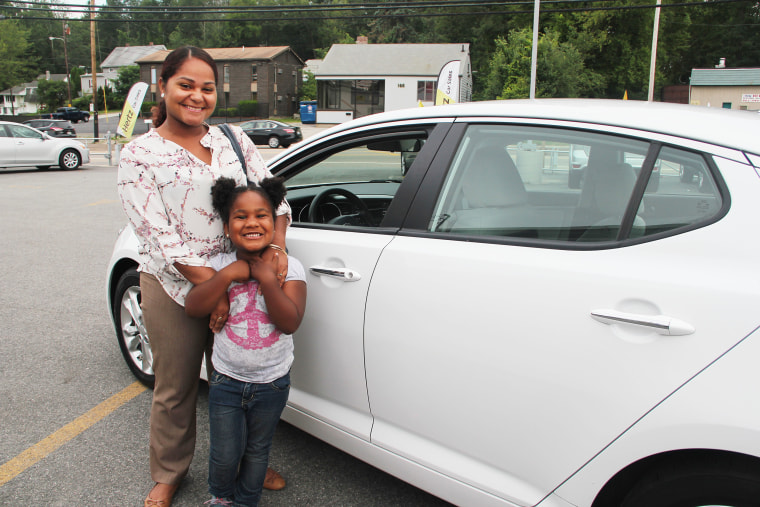 Sherlie Martinez, pictured with her daughter, was able to finance a used car in 2015.