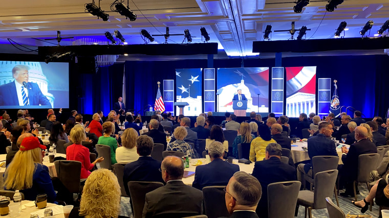 Attendees listen as President Donald Trump addresses the 2020 Council for National Policy meeting in Arlington, Va., on Aug. 21, 2020.