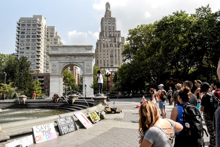 Image: People participate in a "save the children" march and rally