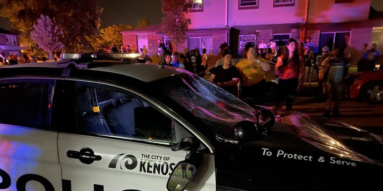 Large crowds gather the scene of an officer-involved shooting in Kenosha, Wisconsin on Sunday.