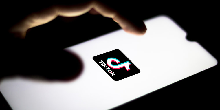 In this photo illustration the TikTok logo seen displayed on