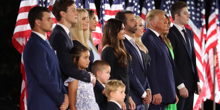 Michael Boulos, Jared Kushner, Ivanka Trump, Lara Trump, Kimberly Guilfoyle, Donald Trump Jr. Tiffany Trump, President Donald Trump, first lady Melania Trump and Barron Trump during the fourth day of the 2020 Republican National Convention on the South Lawn of the White House on Aug. 27, 2020.
