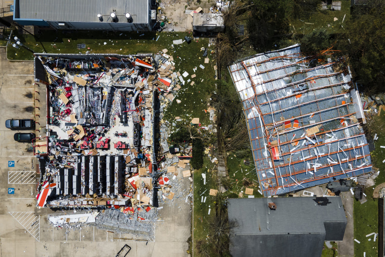 This drone photo shows the roof blown off of an AutoZone store along Nelson Road in the aftermath of Hurricane Laura, Thursday, Aug. 27, 2020, in Lake Charles, La.