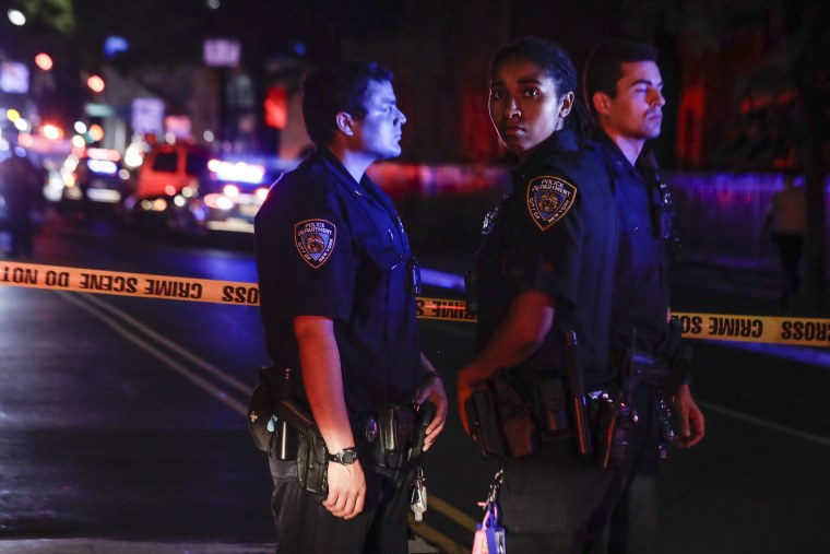 Image: New York City police stand on a street early Thursday, June 4, 2020, in the Brooklyn borough of New York, after a police officer was shot.