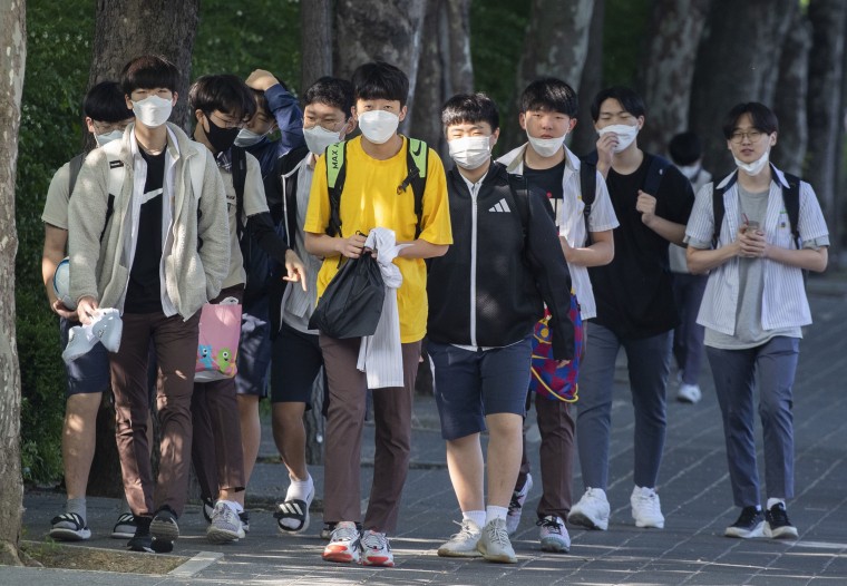 Image: Students return to school for classes at Posung Middle School in Seoul, South Korea