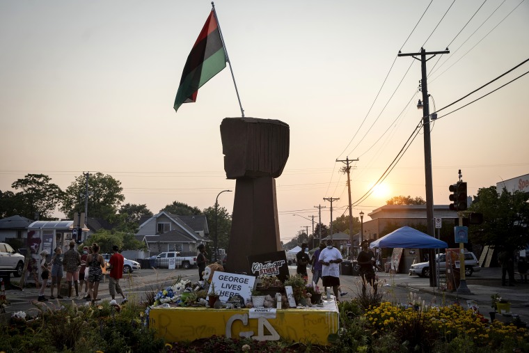 Three months after George Floyd was killed by the police, people visit the memorial set up in his memory in Minneapolis on Aug. 25, 2020