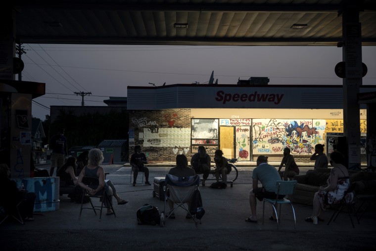 Local residents hold a town hall in Minneapolis on Aug. 25, 2020. Residents and activists meet at the Speedway gas station to discuss building up their community, racial justice and ongoing concerns.