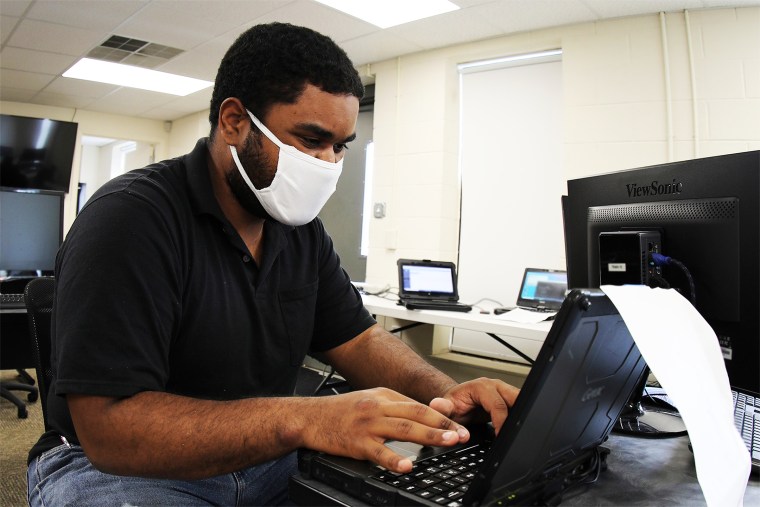 Spc. Carlos Cirano, a Security Analyst assigned to the NCNG Cyber Security Response Force, conducts cyber operations at a City of Roxboro Facility in Roxboro, N.C., on June 18, 2020. The CSRF helped restore city and county computer networks after a cyber-attack in late May.