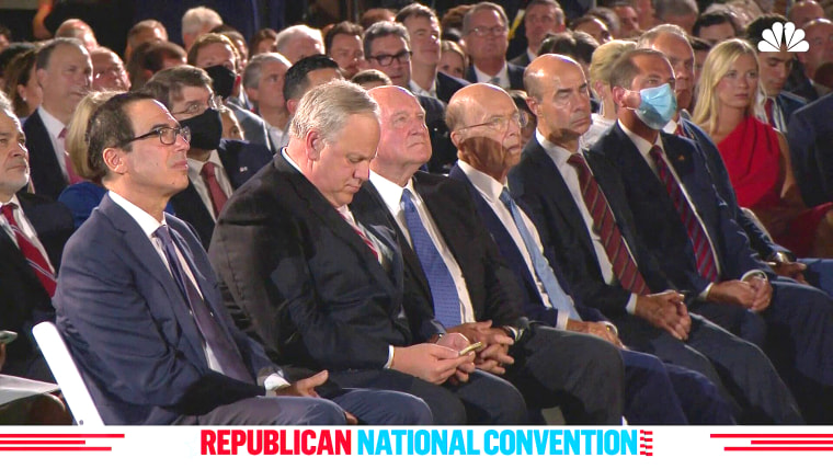 United States Secretary of the Treasury Steve Mnuchin, United States Secretary of Commerce Wilbur Ross, United States Secretary of Health and Human Services Alex Azar and others watch a speech during the Republican National Convention from the South Lawn of the White House on Aug. 27, 2020.