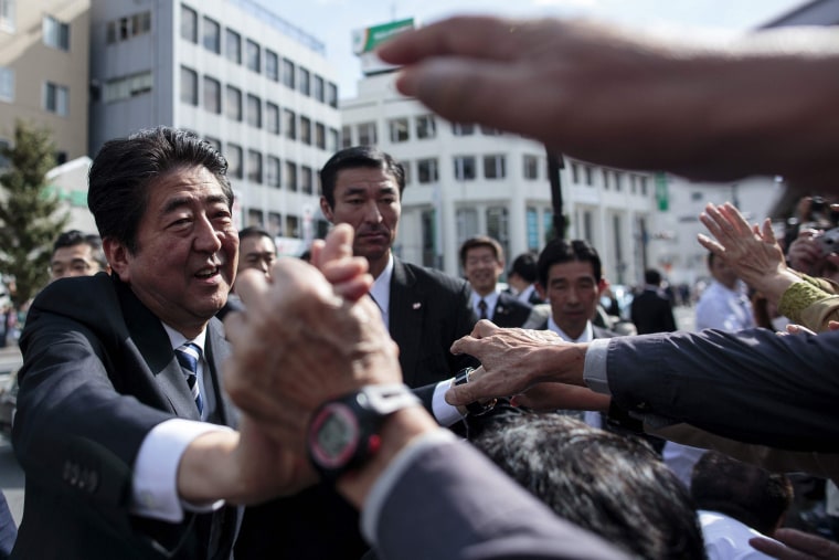 Image: Japan's Prime Minister Shinzo Abe greeting his supporters during an election campaign appearance in Saitama.