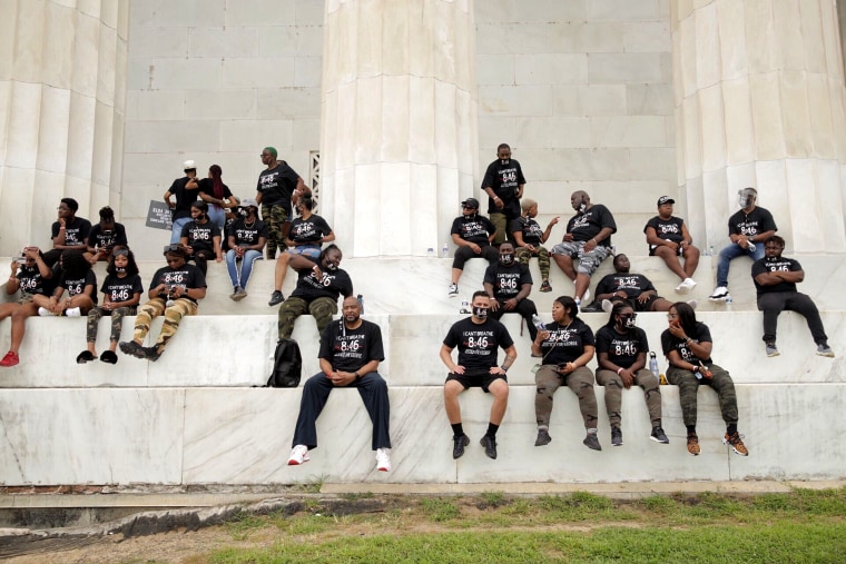 People attend the March on Washington on Aug. 28, 2020, at the Lincoln Memorial.