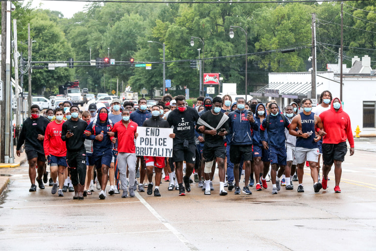 Ole Miss Football players marched from The Manning Center on the Ole Miss Campus to the Oxford Square on Aug. 28th, 2020 in Oxford, Miss.