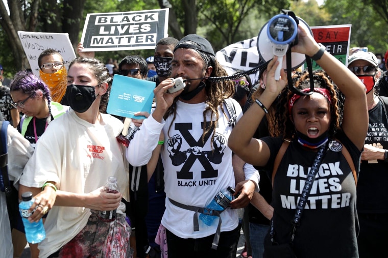 Demonstrators take part in "Get Your Knee Off Our Necks" March on Washington 2020 in support of racial justice on Aug. 28, 2020.