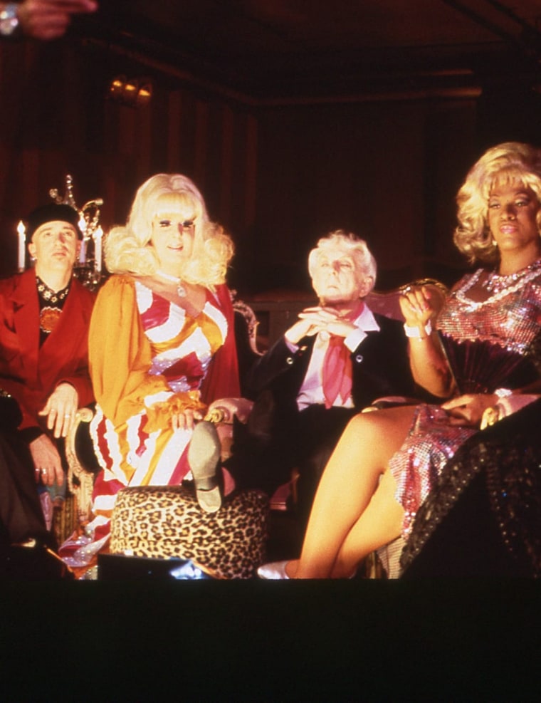 Lady Bunny, Quentin Crisp, José Sarria and Flotilla Debarge as the pageant judges in the film's first scene.
