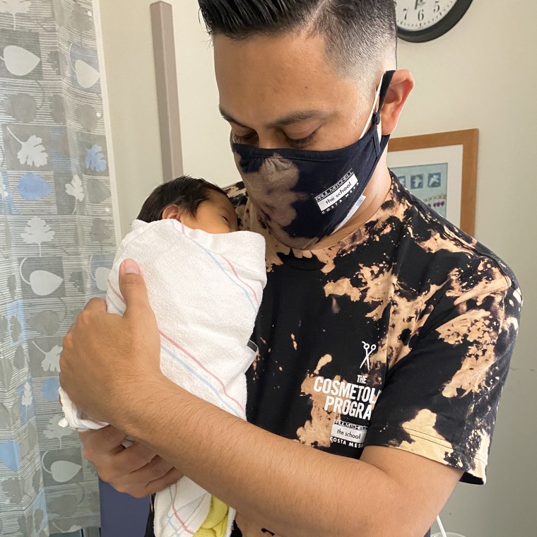 James Alvarez holds his baby girl, Adalyn Rose.