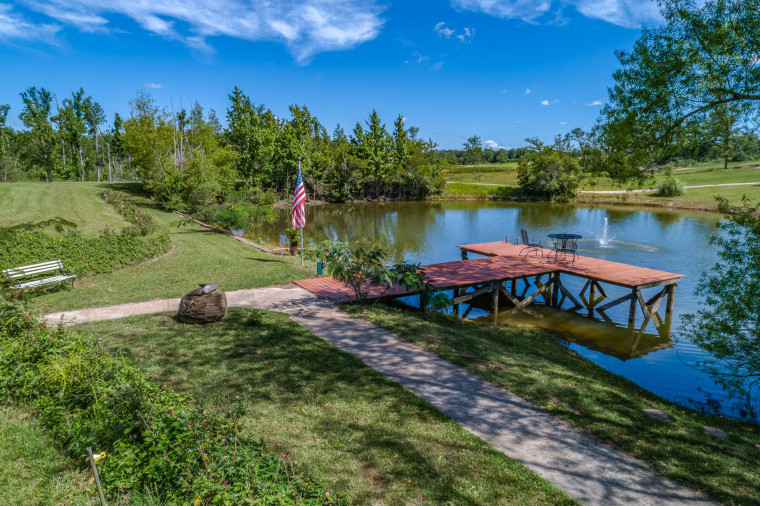 A scenic deck overlooks one of the ponds on the 39-acre property. 