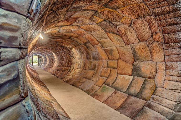 The "Hobbit hole" entrance is painted to look like a brick tunnel. 